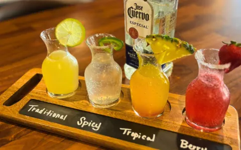 A flight of margaritas in four flavors.