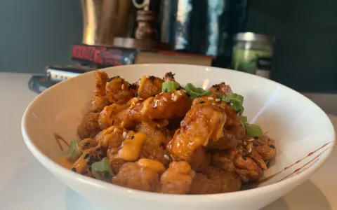 Volcano Shrimp finished with sauce and scallions.